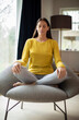 © Daisy Daisy - Peaceful Woman Meditating Sitting In Chair At Home