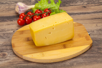 Wall Mural - Hard yellow tasty cheese brick