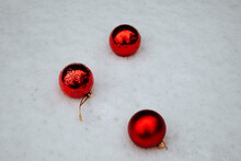 
Red Christmas Decorations On Snowy Roads