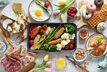 Breakfast Food Table. Festive Brunch Set, Meal Variety With Grill Platter, Fried Egg, Croissant Sandwich, Cheese Platter And Desserts. Overhead View