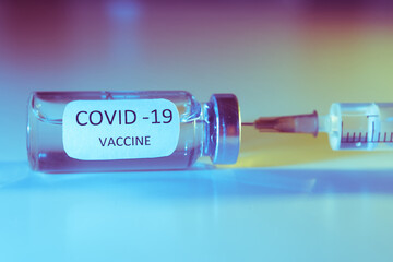 COVID-19 coronavirus vaccine. Ampoule and syringe close-up. Concept