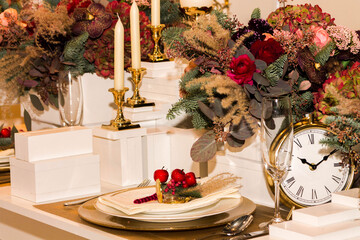 Candles for a romantic dinner. Decorated table for a celebration. Front view.