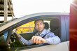 © Ignacio Ferr√°ndiz Roig/Westend61 - Handsome male entrepreneur looking out of window while sitting in car