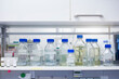 © Buero Monaco/Westend61 - Liquid solution bottles on shelf in laboratory