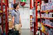 © Clare Seibel-Barnes/Austockphoto - Young man in hardware store shopping for house improvement project