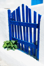 Greece, Cyclades Islands, Santorini, Oia, Blue Fence Outside House