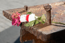 Teddy Bear And Wilted Rose On A Steel Piece Of The Fallen World Trade Center At The Memorial.