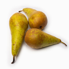 spotted pears on a white background with reflected shadows