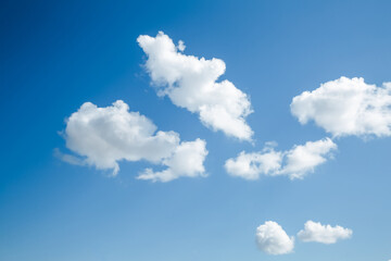 Wall Mural - white, fluffy clouds in blue sky. background from clouds