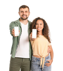 Wall Mural - Young couple with mobile phones on white background