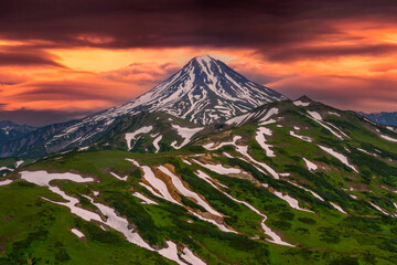 Panoramic view of the city Petropavlovsk-Kamchatsky and volcanoes: Koryaksky Volcano, Avacha Volcano, Kozelsky Volcano. Russian Far East, Kamchatka Peninsula.