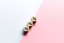 Wooden Blocks Stacking As Step Stair With Percent Or Percentage Symbol On Pink And White Background. Sales Discount Or Financial Interest Rate