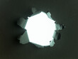 © Daco - Torn hole in a black paper sheet