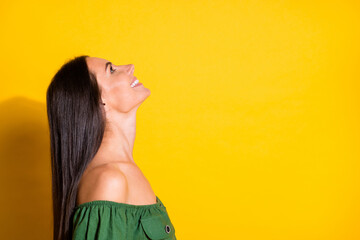 Poster - Side profile photo portrait of beautiful brunette looking up at blank space smiling isolated on bright yellow color background