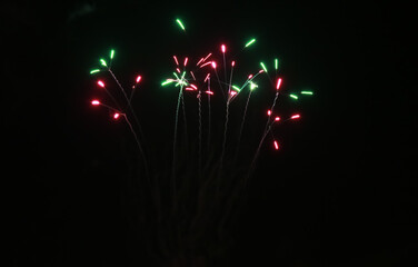 New Year fireworks on the black sky background