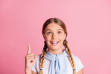 Canvas Print - Photo of young girl happy smile look point finger empty space suggest choice advert tight jumper isolated over pastel color background