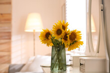 Beautiful Bouquet Of Sunflowers In Vase On White Table Indoors. Space For Text