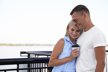 Sticker - Happy couple with drink on city waterfront