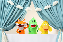 Creative Puppet Show On White Stage Indoors