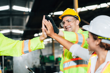 Teamwork and team spirit worker group give high five together corporate trust concept.industry celebrate reward success good teamwork result in factory