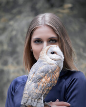 Misterioius Young Blond Girl With A Barn Owl White Bird In A Foggy Forest
