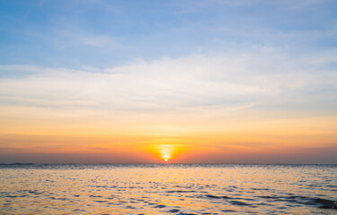 Wall Mural - sunset sky over sea in the evening with colorful orange sunlight sky landscape background.