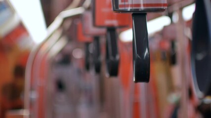 Canvas Print - POV to the hand held inside commuter of the skytrain/subway