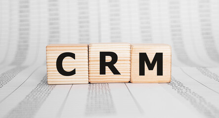 Poster - Word CRM made with wood building blocks, business concept.
