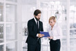 © Ivan - businessman to discuss information with a younger colleague in a