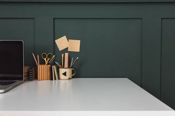 Canvas Print - Table with drawing supplies at artist home office.