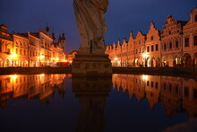 Renaissance houses in Czech town Telč reflected in fountain. Czech tourism