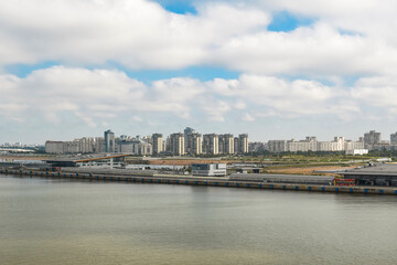 Wall Mural - Soviet era housing complexes line up next to newer apartments at the port of Saint Petersburg, Russia