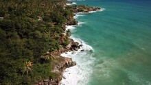 Aerial Tilt Up And Flying Forward Over Turquoise Water Along Haiti Coast
