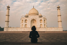 Young Woman Admiring Taj Mahal Beauty During Sunrise Time On A Cloudy Day, Agra, India
