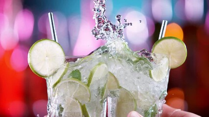 Aufkleber - Super slow motion of mojito drinks in cheers gesture. Filmed on high speed cinema camera, 1000 fps.