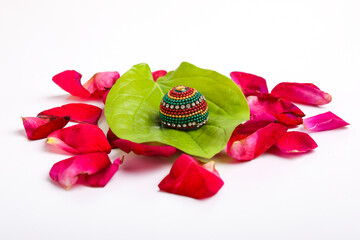 Wall Mural - decorative green leaf with betel nuts on white background