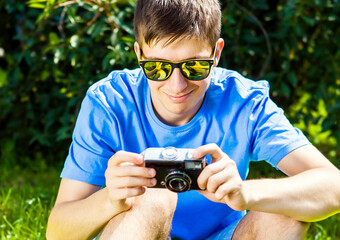 Canvas Print - Young Man with a Photo Camera