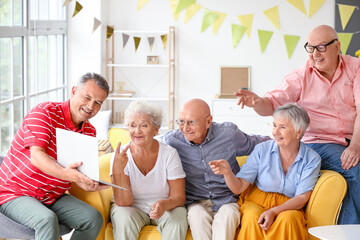 Poster - Group of senior people video chatting at home