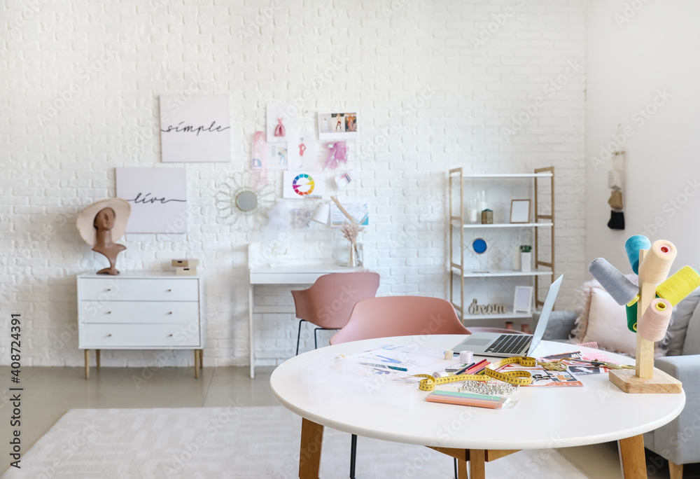 Stylish interior of fashion designer workplace