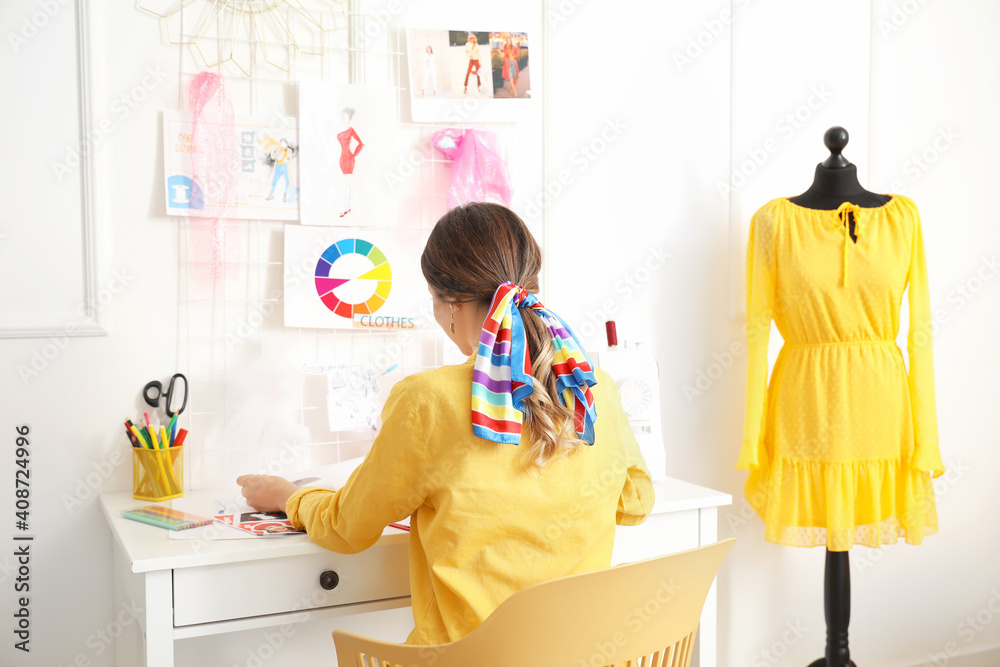 Female fashion designer working in studio