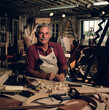 © SuperStock - Portrait of male carpenter working in his wood shop