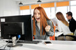 © Roman - female office worker woman has wow reaction sitting at office desk and looking at computer screen, she is surprised excited receive good online results