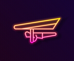 Poster - Glowing neon line Hang glider icon isolated on black background. Extreme sport. Vector Illustration.