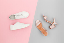White Sneakers And Pink Heeled Sandals On Grey And Pink Paper Background. Stylish Spring Or Summer Woman's Shoes In Pastel Colors. Trendy Beauty Female Fashion Background. Flat Lay, Top View.