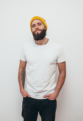 Poster - Young bearded hipster guy wearing white blank t-shirt. Mock-up for print. T-shirt template.