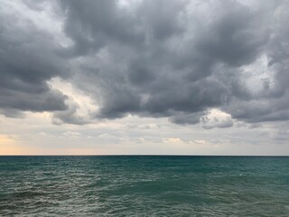 Wall Mural - Stormy seascape background, rainy clouds