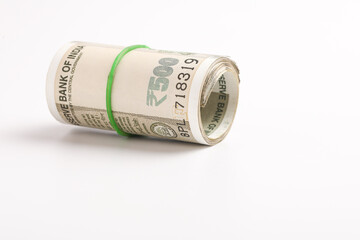 A stack of five hundred rupee notes (Indian currency) isolated on a white background.