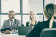 © Mangostar - Serious employer and HR manager talking to job candidate at interview. Back view, closeup. Human resource and career concept