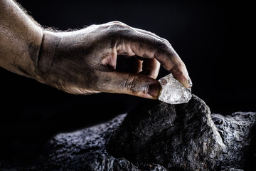 Poster - hand removing rare stone from a mine, chinese diamond digging