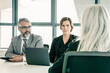 © Mangostar - Two employers talking to professional at job interview. Back view, closeup. Human resource and career concept